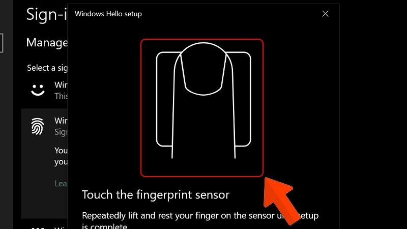 Đặt ngón tay lên cảm biến vân tay laptop để Windows Hello ghi nhận Đặt ngón tay lên cảm biến vân tay laptop để Windows Hello ghi nhận